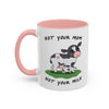 A white ceramic mug with a pink interior and handle, featuring a cartoon illustration of a black-and-white cow and calf on a green patch of grass, with the text 'NOT YOUR MOM NOT YOUR MILK' printed on the front.