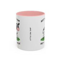 A white ceramic mug with a pink interior, featuring a cartoon cow illustration and the text 'NOT YOUR MOM, NOT YOUR MILK' and 'LITTLE COW SHOP'.